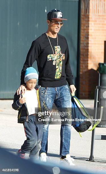 Real Madrid football player Cristiano Ronaldo is seen with his son Cristiano Ronaldo Jr at school on January 19, 2015 in Madrid, Spain.