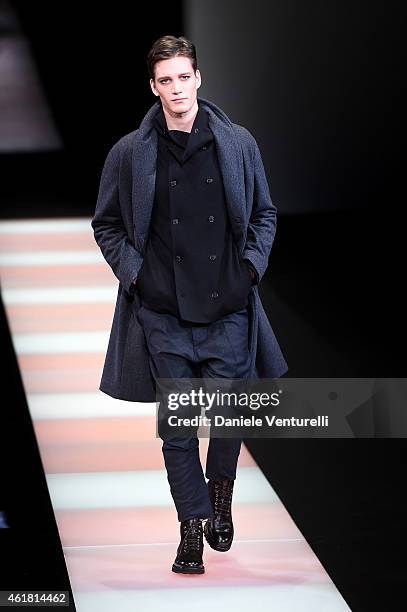 Model walks the runway during the Giorgio Armani show as a part of Milan Menswear Fashion Week Fall Winter 2015/2016 on January 20, 2015 in Milan,...