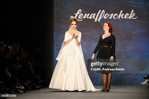 Designer Lena Hoschek and a model on the runway after the Lena Hoschek show during the Mercedes-Benz Fashion Week Berlin Autumn/Winter 2015/16 at...