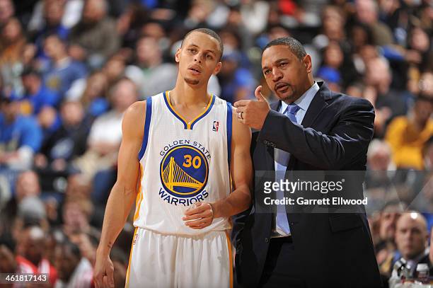 Head Coach Mark Jackson of the Golden State Warriors coaches player Stephen Curry against the Boston Celtics on January 10, 2014 at Oracle Arena in...