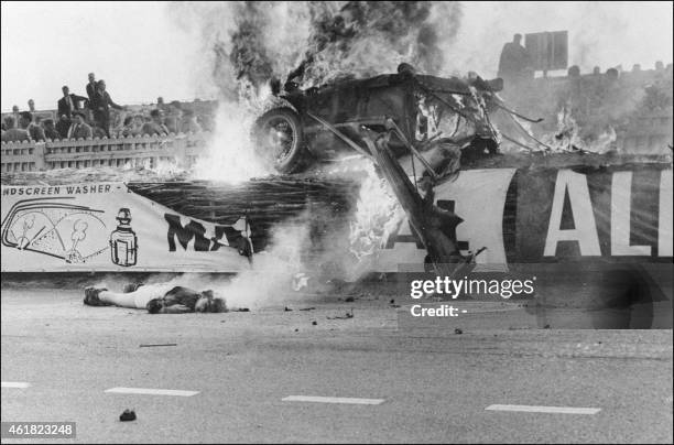 Graphic content / The body of French pilot Pierre Levegh lies dead after his Mercedes Benz 300 SLR hit the stands and exploded, on June 11, 1955...