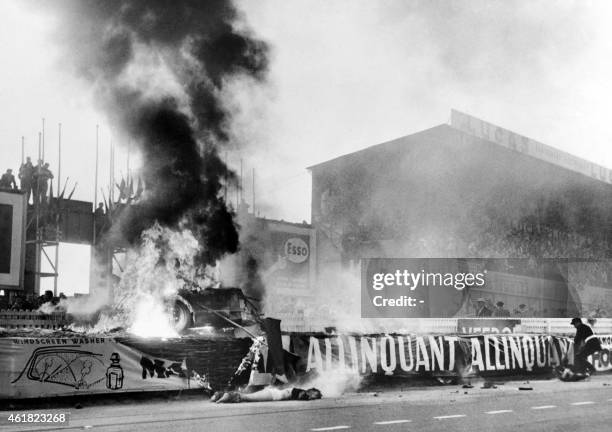 Graphic content / The body of French pilot Pierre Levegh lies dead after his Mercedes Benz 300 SLR hit the stands and exploded, on June 11, 1955...