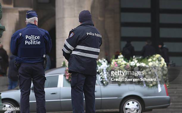 Policemen stand guard at the funeral service for soccer player Junior Malanda at Basilica of the Sacred Heart on January 20, 2015 in Brussels,...