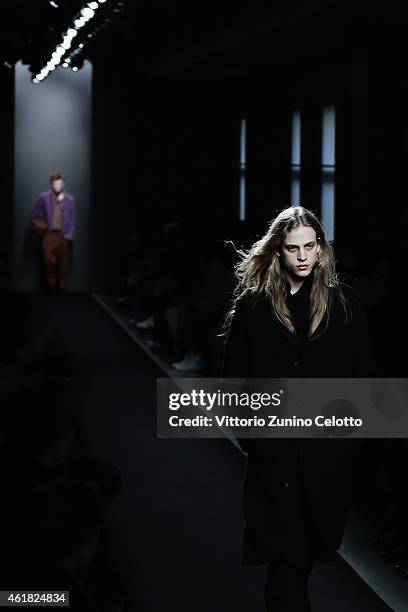 Model walks the runway during the Bottega Veneta Show as a part of Milan Menswear Fashion Week Fall Winter 2015/2016 on January 18, 2015 in Milan,...