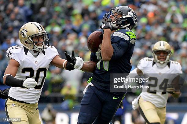 Wide receiver Percy Harvin of the Seattle Seahawks is unable to make a catch against cornerback Jeremy Lane of the Seattle Seahawks but the Saints...