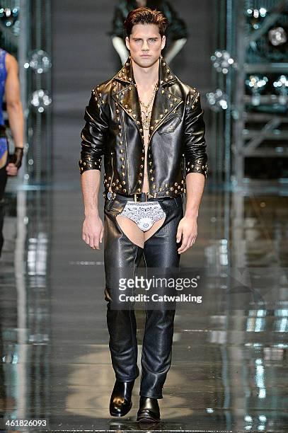 Model walks the runway at the Versace Autumn Winter 2014 fashion show during Milan Menswear Fashion Week on January 11, 2014 in Milan, Italy.