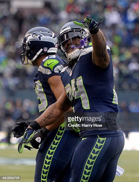 Running back Marshawn Lynch of the Seattle Seahawks celebrates after Lynch scores on a 15-yard run in the second quarter against the New Orleans...