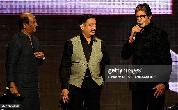 Bollywood film actor Amitabh Bachchan speaks as actors Kamal Haasan and Rajinikanth look on during the music launch of Bachchan's new film...