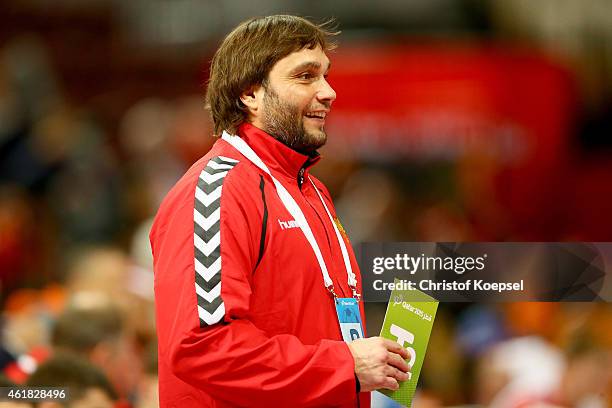 Head coach Oleg Kuleshov of Russia smiles uring the IHF Men's Handball World Championship group D match between Poland and Russia at Lusail...