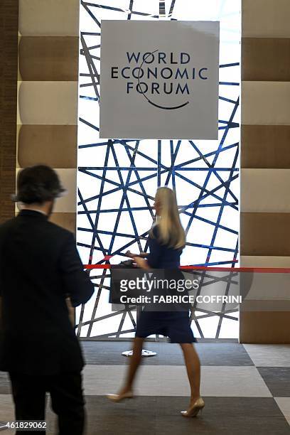 People enter the Congress Center in Davos on January 20, 2015 on the eve of the World Economic Forum annual meeting. World leaders including France's...