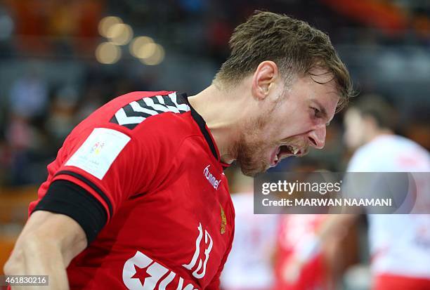 Russia's Sergey Sorbok celebrates after scoring a goal during the 24th Men's Handball World Championships preliminary round Group D match between...