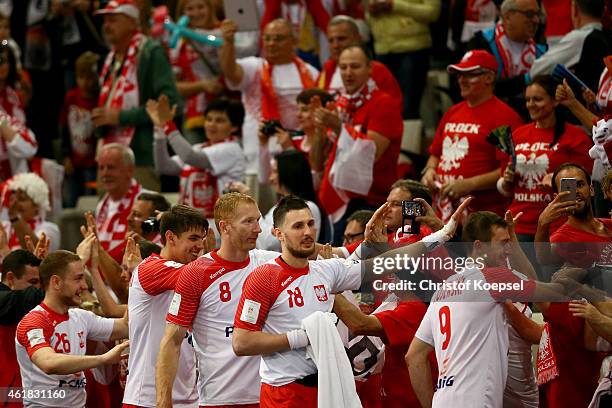 The team of Poland celebrates with the fans after the IHF Men's Handball World Championship group D match between Poland and Russia at Lusail...