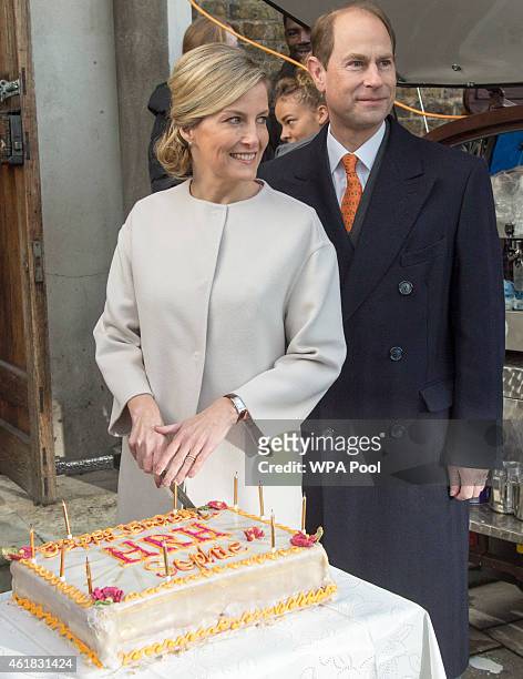 Sophie, Countess of Wessex and Prince Edward, Earl of Wessex pose with the Countess' birthday cake made by a person formerly helped by Tomorrow's...