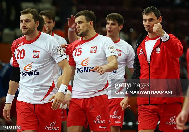 Poland team members celebrate their win during the 24th Men's Handball World Championships preliminary round Group D match between Poland and Russia...