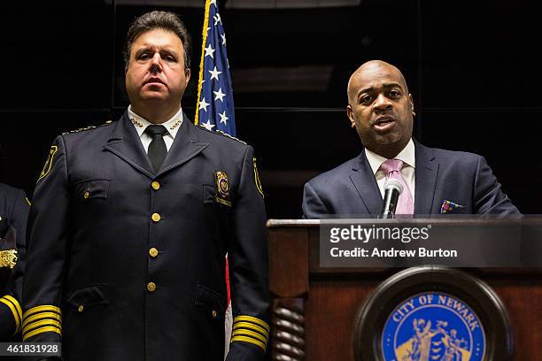 Newark Mayor Ras Baraka speaks as Newark Police Chief Anthony Campos looks o during a press conference regarding the Department of Justice's...