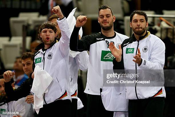 Johannes Sellin, Jens Schoengarth and Michael Mueller of Germany celebrate a goal during the IHF Men's Handball World Championship group D match...