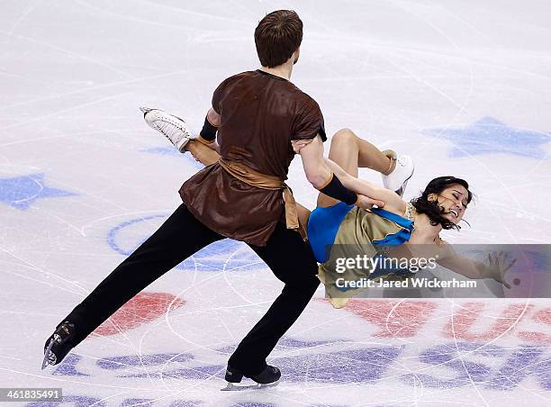 Lynn Kriengkrairut and Logan Giulietti-Schmitt skate in the free dance program during the 2014 Prudential U.S. Figure Skating Championships at TD...