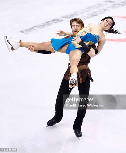 Lynn Kriengkrairut and Logan Giulietti-Schmitt skate in the free dance program during the 2014 Prudential U.S. Figure Skating Championships at TD...