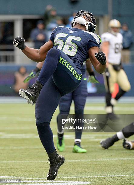 Defensive end Cliff Avril of the Seattle Seahawks celebrates after stopping the New Orleans Saints in the third quarter during the NFC Divisional...