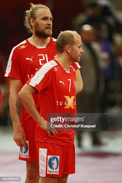 Henrik Moellgaard and Anders Eggert of Denmark look dejected after the IHF Men's Handball World Championship group D match between Denmark and...