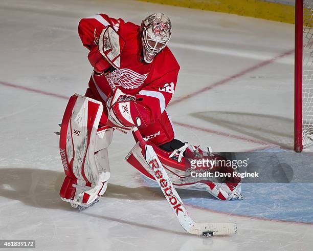 Tom McCollum of the Detroit Red Wings passes the puck up ice during a NHL game against the Buffalo Sabres on January 18, 2015 at Joe Louis Arena in...