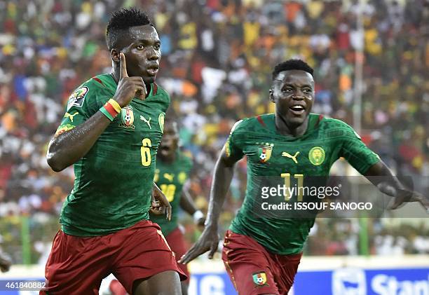 Cameroon's defender Ambroise Oyongo celebrates with Cameroon's midfielder Edgar Salli after scoring a goal during the 2015 African Cup of Nations...