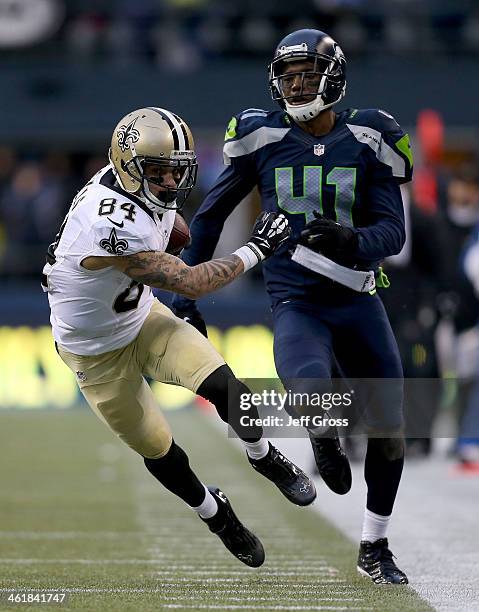 Wide receiver Kenny Stills of the New Orleans Saints runs after a catch against cornerback Byron Maxwell of the Seattle Seahawks in the fourth...