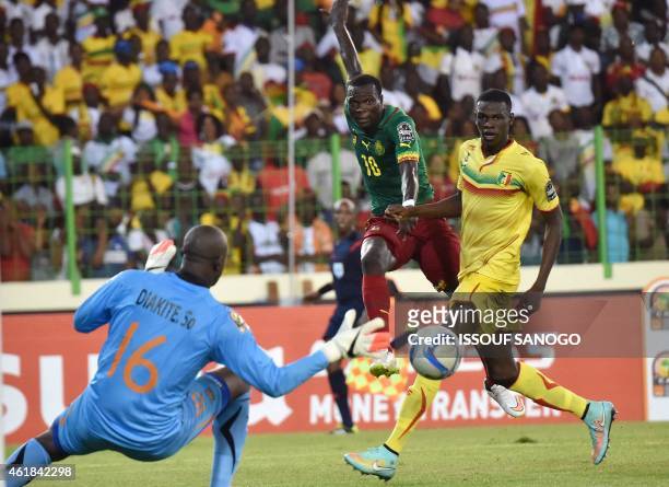 Mali's goalkeeper Soumbeylia Diakite dives to save a shot on goal by Cameroon's forward Vincent Aboubakar during the 2015 African Cup of Nations...