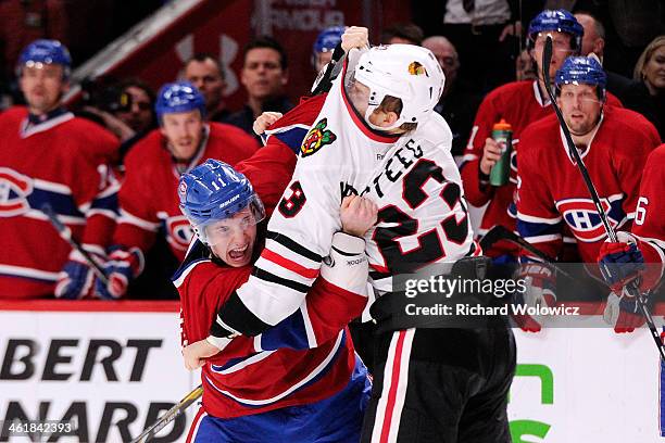 Brendan Gallagher of the Montreal Canadiens and Kris Versteeg of the Chicago Blackhawks fight during the NHL game at the Bell Centre on January 11,...