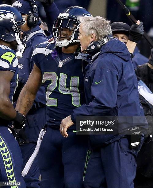 Head coach Pete Carroll of the Seattle Seahawks celebrates with running back Marshawn Lynch after Lynch scores a touchdown in the fourth quarter...