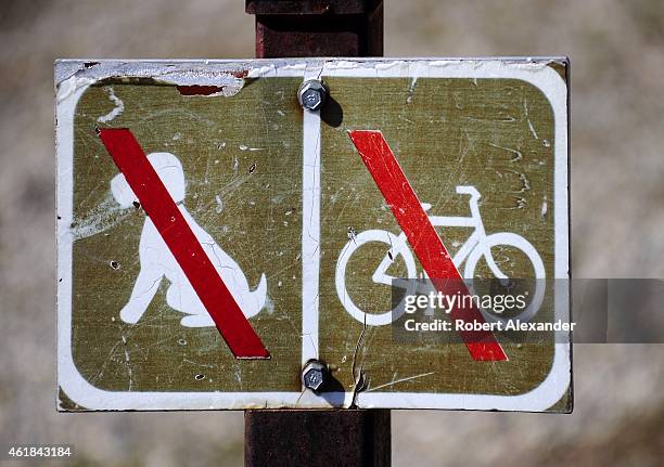 National Park Service sign along a hiking trail in Grand Teton National Park in Wyoming advises visitors that pets and bicycles are not allowed on...