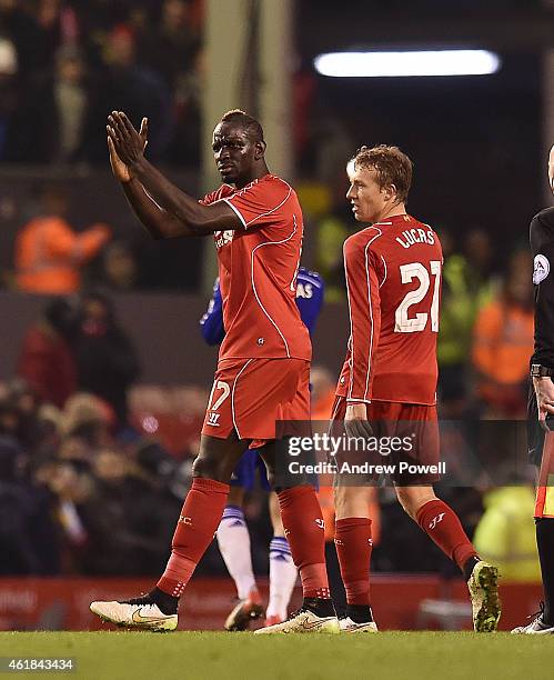 Mamadou Sakho and Lucas Lieva of Liverpool clap to the fans at the end of the Capital One Cup Semi-Final First Leg between Liverpool and Chelsea at...