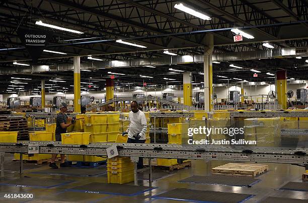 Amazon.com workers pack orders at an Amazon fulfillment center on January 20, 2015 in Tracy, California. Amazon officially opened its new 1.2 million...