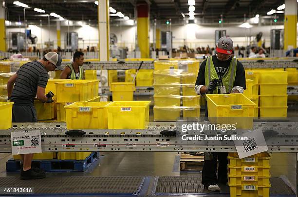 Amazon.com workers pack orders at an Amazon fulfillment center on January 20, 2015 in Tracy, California. Amazon officially opened its new 1.2 million...