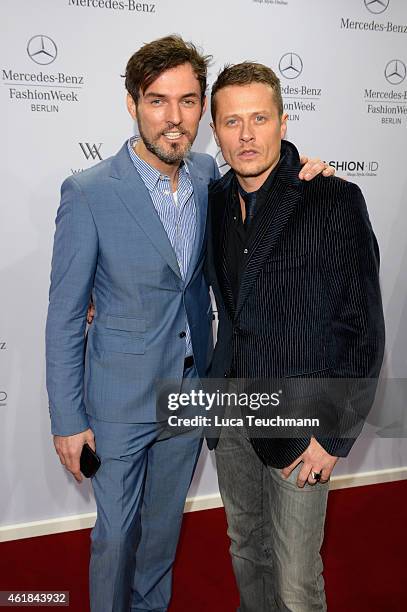 Tobey Wilson and Roman Knizka attend the Riani show during the Mercedes-Benz Fashion Week Berlin Autumn/Winter 2015/16 at Brandenburg Gate on January...