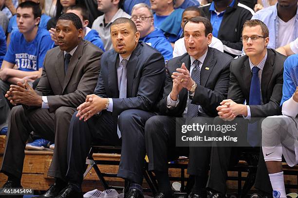 Assistant Coach Nate James, Associate Head Coach Jeff Capel, Head Coach Mike Krzyzewski and Assistant Coach Jon Scheyer of the Duke Blue Devils look...