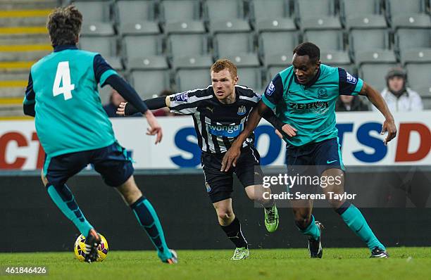 Adam Campbell of Newcastle is challenged by Blackburns Ryan Nyambe during for the U21 Premier League Cup Quarter Final match between Newcastle United...