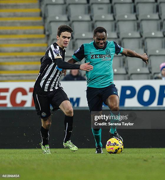 Alex Gilliead of Newcastle challenges Blackburns Ryan Nyambe whilst running with the ball during for the U21 Premier League Cup Quarter Final match...