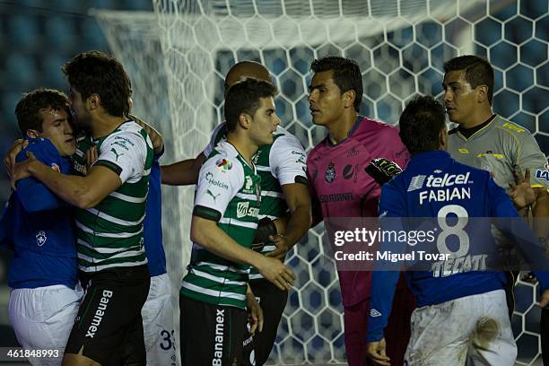 Jeronimo Amione of Cruz Azul discusses with Javier Orozco of Santos during a match between Cruz Azul and Santos Laguna as part of the Clausura 2014...