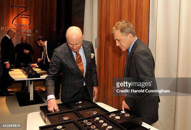 Schaffhausen CEO George Kern and Christoph Waltz visit the IWC booth during the Salon International de la Haute Horlogerie 2015 at the Palexpo on...