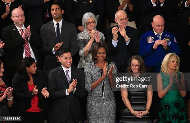 Victor Fugate of Kansas City, Missouri, Dr. Pranav Shetty of Washington, DC, Judy Gross, Alan Gross, NASA Astronaut Scott Kelly Astrid Muhammad of...