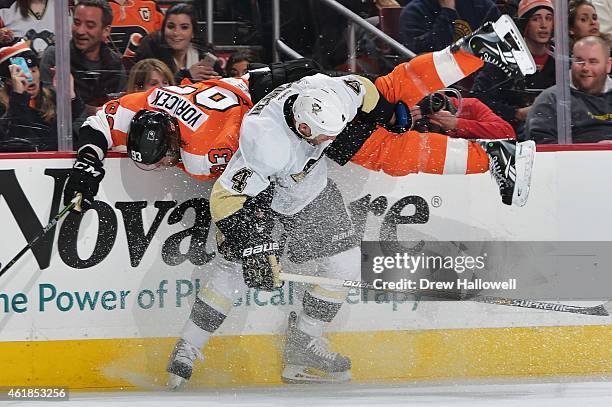 Jakub Voracek of the Philadelphia Flyers gets upended by Rob Scuderi of the Pittsburgh Penguins at the Wells Fargo Center on January 20, 2015 in...