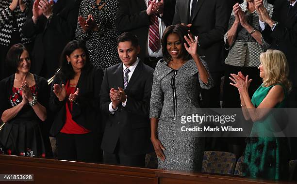 First lady Michelle Obama waves standing with Carolyn Reed of Denver, Colorado, Astrid Muhammad of North Carolina, Anthony Mendez of Bronx, New York...