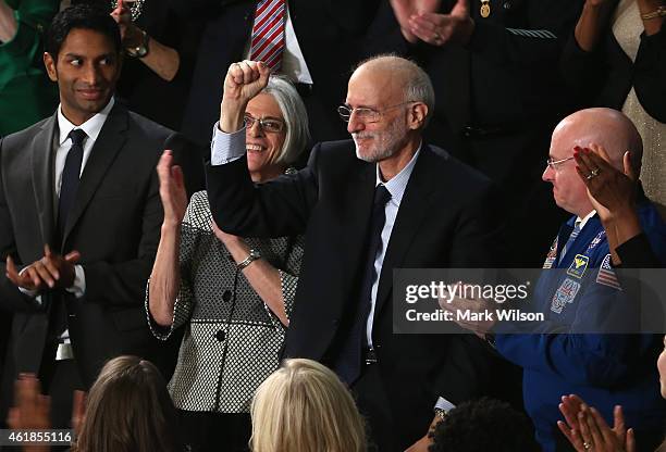 Alan Gross , recently freed after being held in Cuba since 2009, pumps his fist after being recognized by U.S. President Barack Obama during the...