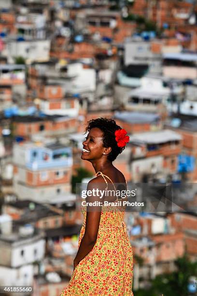 Portrait of beautiful black young woman at Complexo do Alemao, Rio de Janeiro favela. Since 2012 the area has operations of the Pacifying Police Unit...