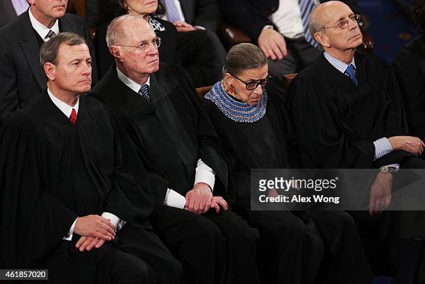 Supreme Court Chief Justice John Roberts, Justice Anthony Kennedy, Justice Ruth Bader Ginsburg and Justice Stephen Breyer listen as U.S. President...