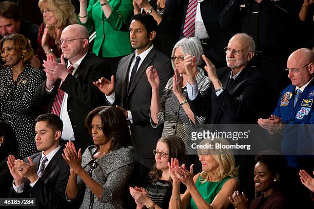 First Lady Michelle Obama, bottom row second left, astronaut Scott Kelly, top row from right, aid worker Alan Gross, a former Cuban prisoner, and his...