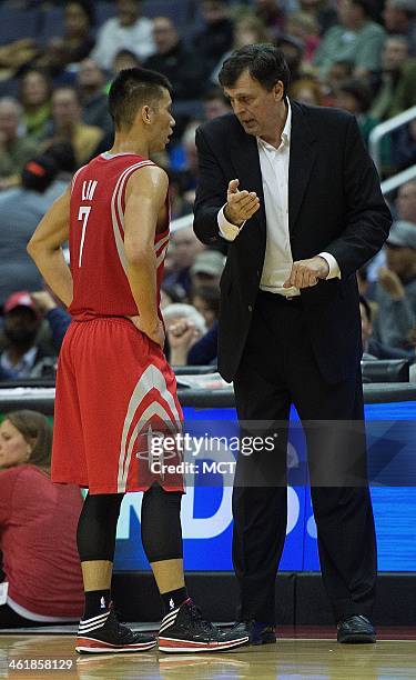 Houston Rockets head coach Kevin McHale talks with Houston Rockets point guard Jeremy Lin during a time-out in the first half of their game against...