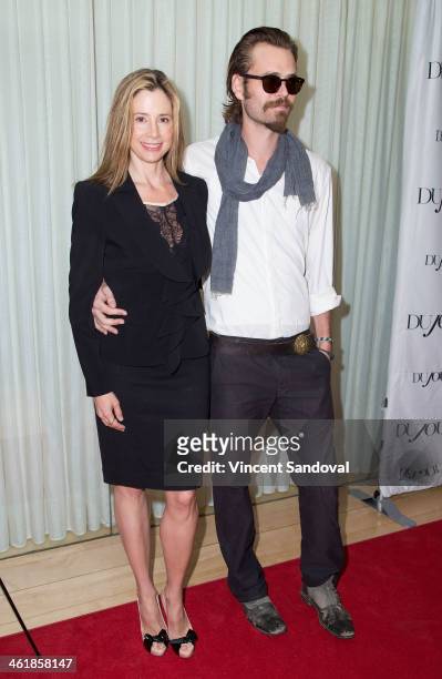 Actress Mira Sorvino and actor Christopher Backus attend the DuJour Magazine celebrates great performances issue featuring "12 Years A Slave" Golden...