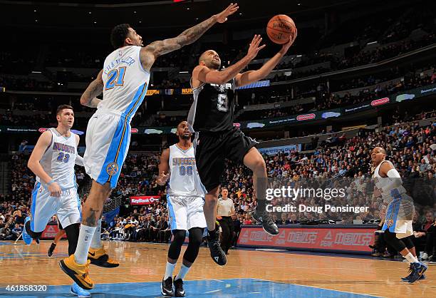 Tony Parker of the San Antonio Spurs lays up a shot against Wilson Chandler of the Denver Nuggets as Jusuf Nurkic, Darrell Arthur and Randy Foye of...